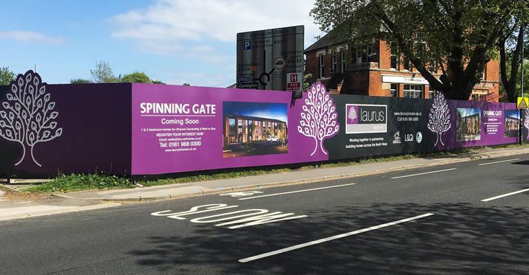 Photograph of site hoarding printed by Property DP